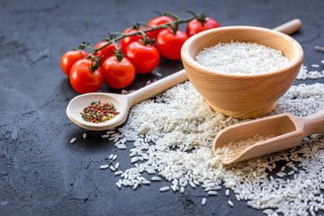 ingredients for paella on dark background