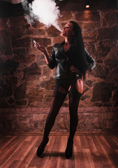 sexy woman smoking electronic cigarette, vape mod concept
