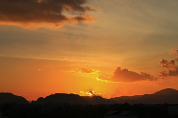 sky in sunset and motion cloud, beautiful colorful twilight time with mountain silhouette