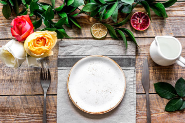 ceramic tableware top view on wooden background mock up