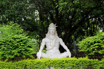 Statue of Hindu Lord Shiva under the tree, Rishikesh. India