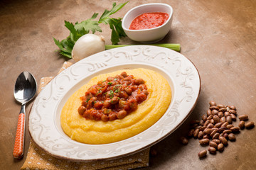 porridge with beans and tomatoes sauce