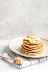 cooked pancake on plate at wooden background