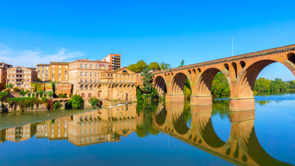 Albi in Southwestern France. Albi is a world heritage UNESCO site. View of the Tarn River and the Cathedral Saint Cecile. - obrazy, fototapety, plakaty
