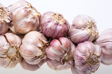 String of garlic isolated on white background
