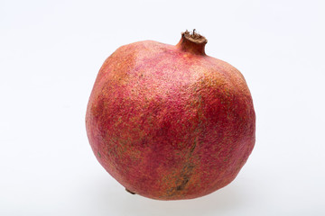 red pomegranate isolated on a white background