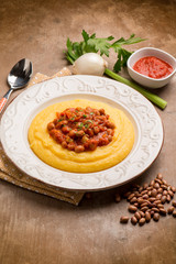 porridge with beans and tomatoes sauce