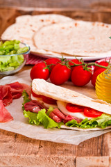 Piadina with ham and lettuce. 