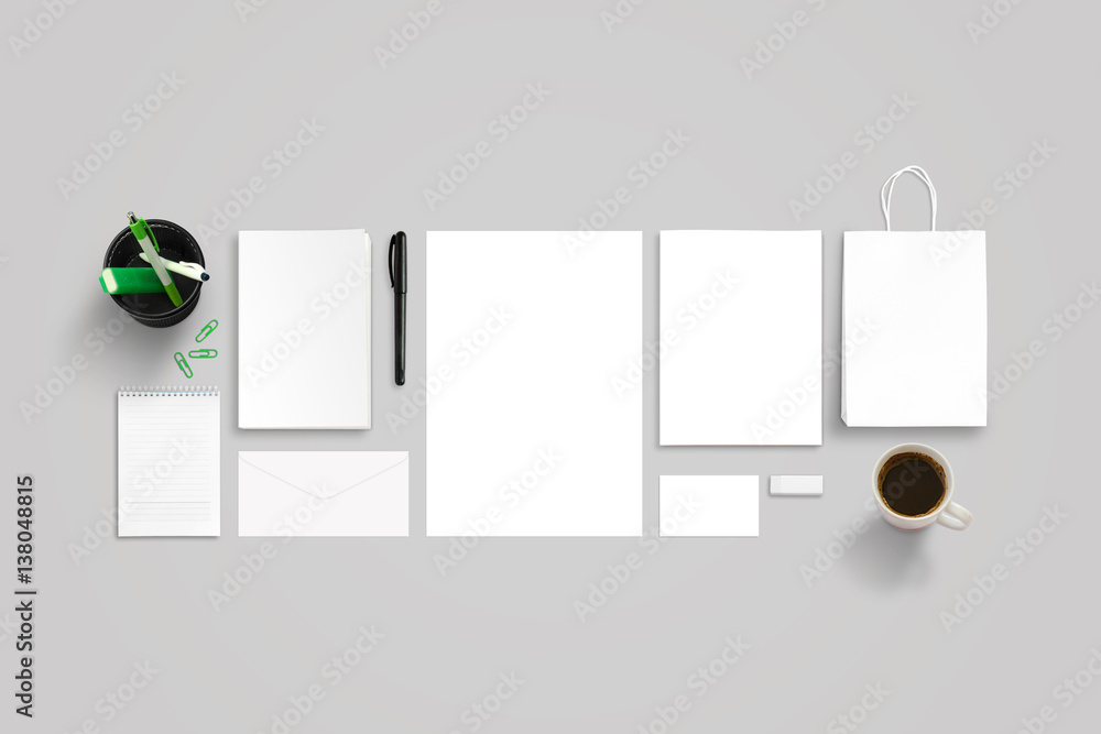 Aufkleber clean stationery and office accessories on gray work desk. top view of isolated objects for branding