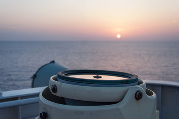 Maritime compass on the sunset.