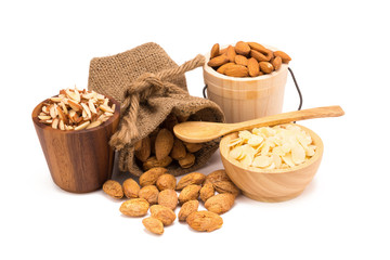 Nuts Almond in a wooden bowl isolated on white background.