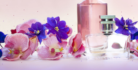 Obraz na płótnie Canvas bottle of women's perfume on a pink background