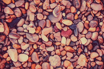 Natural vintage pebbles background in trendy rose color