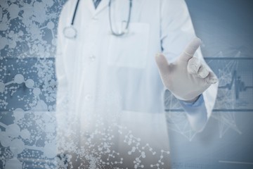 Composite image of doctor touching an digital screen 