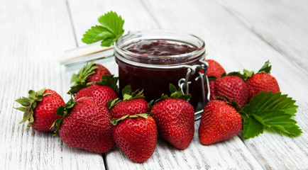 Strawberry jam and fresh strawberries