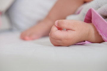 Close up of a small hand the sleeping baby.Little infant child baby kid hand.