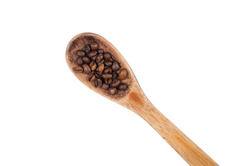 Spread coffee seeds and spoon on a white background