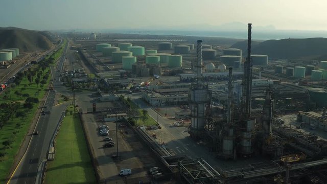 Ventanilla Peru Aerial v13 Flying low over oil refinery panning down and over.