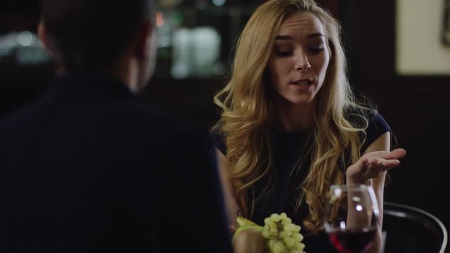 blondie arguing with partner in restaurant