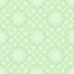 Seamless pattern of round white mandala on green background