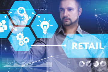 Business, Technology, Internet and network concept. Young businessman shows the word on the virtual display of the future: Retail