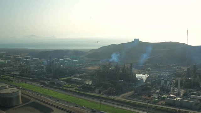 Ventanilla Peru Aerial v18 Flying low over oil refinery panning.