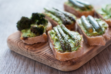 Green vegetarian sandwiches selection made with avocado, courgette, asparagus, broccoli