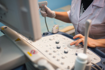 Ultrasound machine doctor"s hand usg investigation USCG