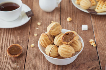 Cookies nuts with cream  and coffee