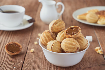 Cookies nuts with cream  and coffee