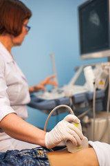 Ultrasound machine doctor"s hand usg investigation USCG