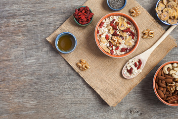 Paleo style breakfast: gluten free and oat free muesli made with nuts, dried berries and fruits, top view