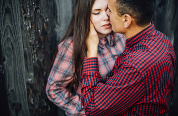 Beautiful loving couple in hipster fashion style posing on mountain