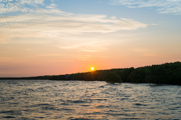 Sunset / sunrise with clouds, Colorful Clouds over tropical sea.