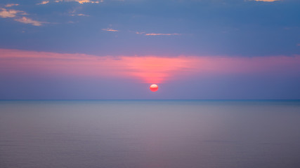 Sunset / sunrise with clouds, Colorful Clouds over tropical sea.