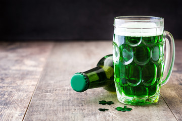 Traditional cold green beer for Saint Patrick's Day  on wooden background.Copyspace
