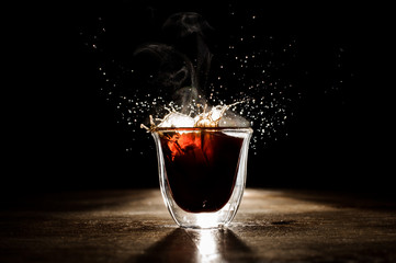 The ice falling into coffee