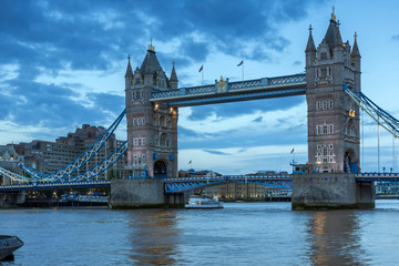 Fototapeta na wymiar LONDON, ENGLAND - JUNE 15 2016: Tower Bridge in London in the late afternoon, England, Great Britain