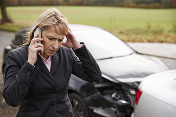Woman Calling To Report Car Accident On Country Road