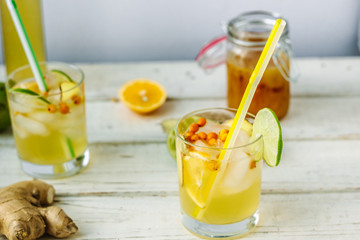 Fresh Ginger lemonade over white wooden background