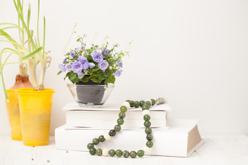 small blooming flowers on a white wooden table