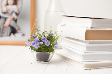 small blooming flowers on a white wooden table