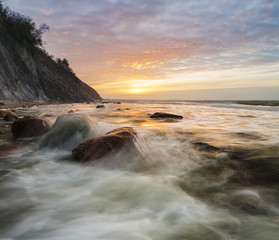 a spectacular, dynamic sunset around the cliffs in Wolin national park in Poland
