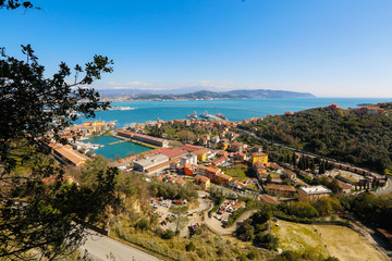 Fototapeta na wymiar Panorama with a harbour, houses, sea and mountains