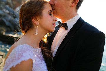 Portrait of a groom and bride, selective focus
