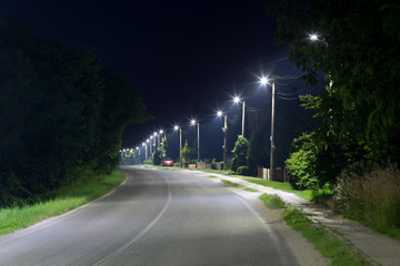 long village street with LED streetlights
