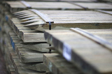 Bags on pallets of wood products prepared for export in stock in trading port