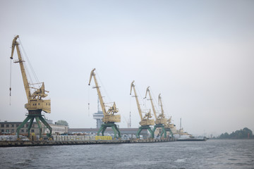 Fototapeta na wymiar View of the coastline, warehouses and cargo port terminal