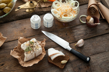 Ukrainian pork lard prepared for lunch with bread and pickle. Tasty, high calorie meal for people who is not on diet.