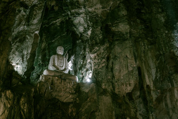 A buddha statue in a cave